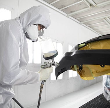 Collision Center Technician Painting a Vehicle | Peruzzi Toyota in Hatfield PA